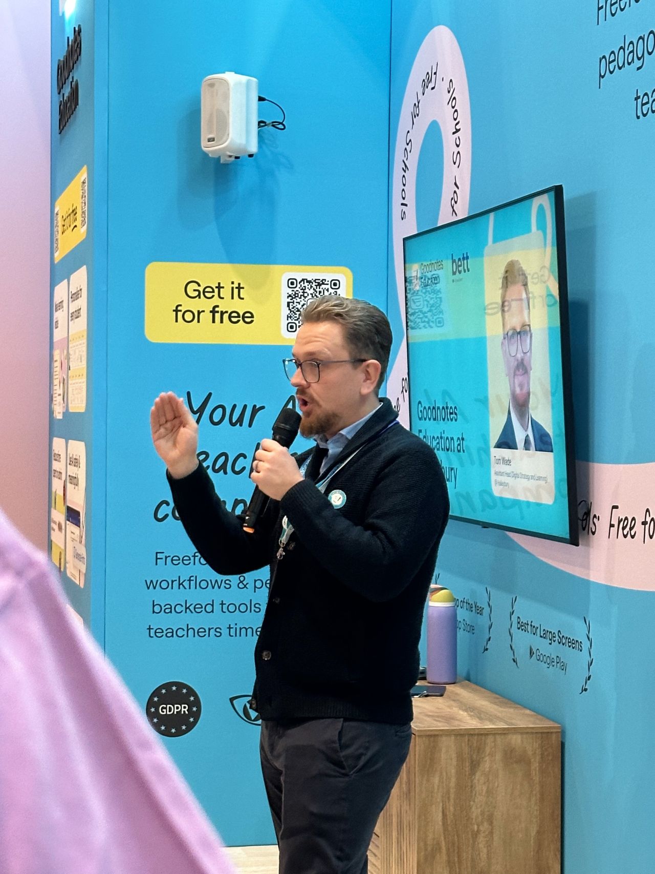 Speaker presenting at the stand