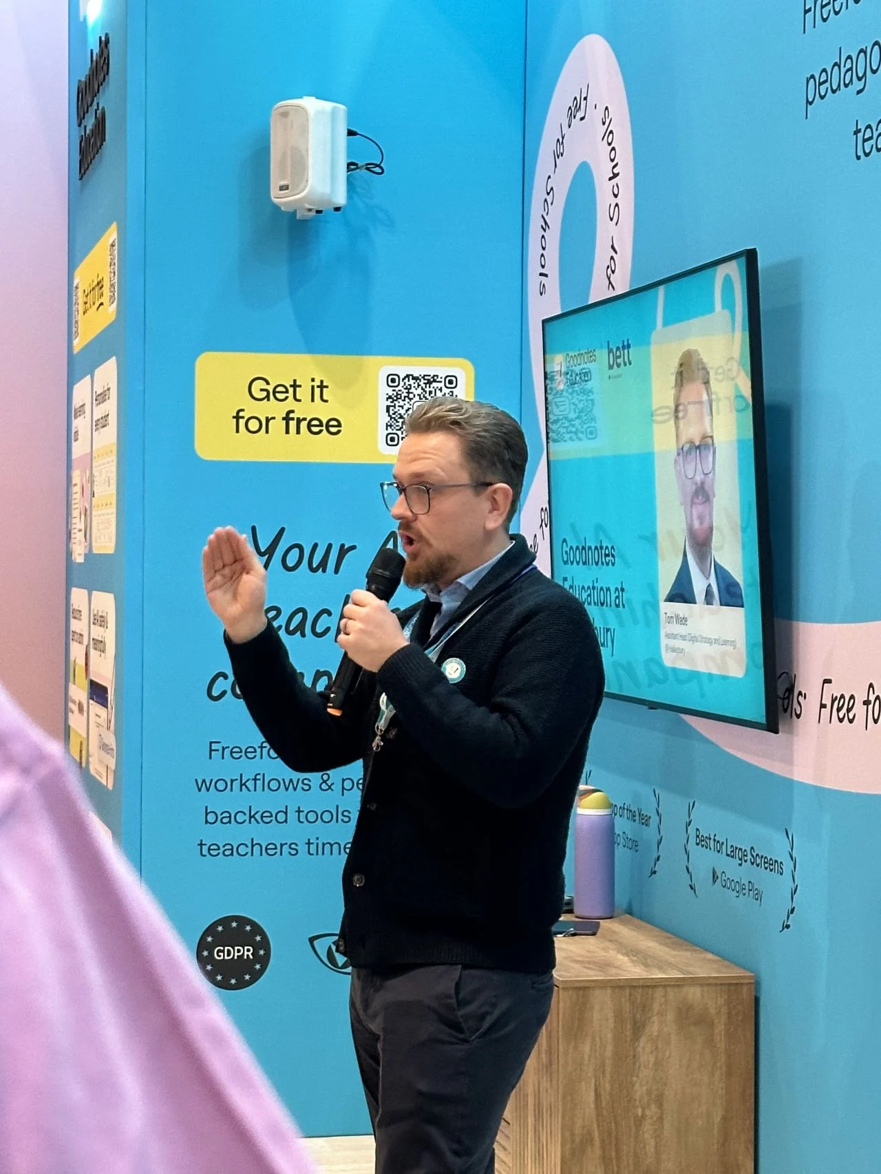 Speaker presenting at the stand