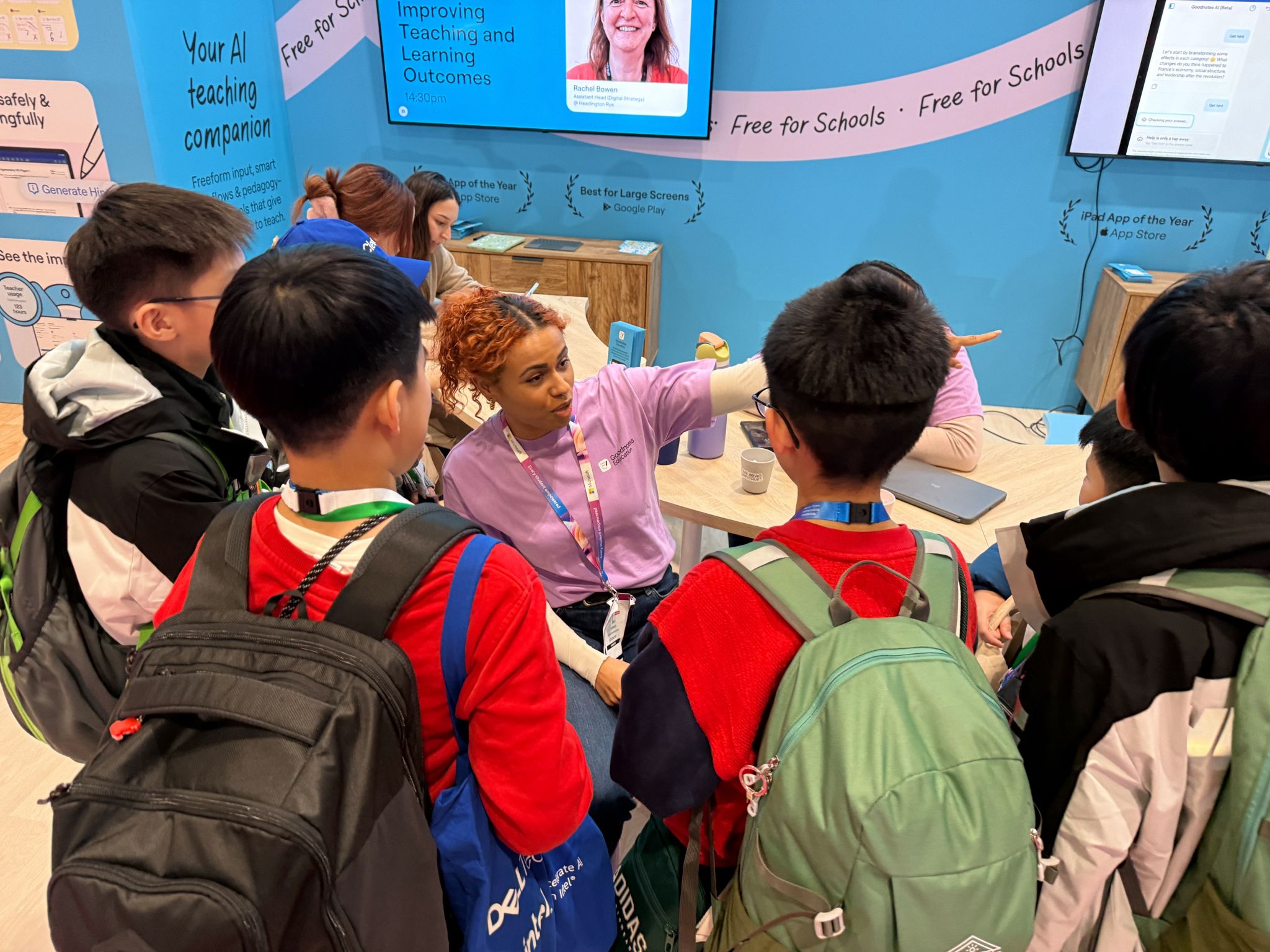 Students gathered around a demo table