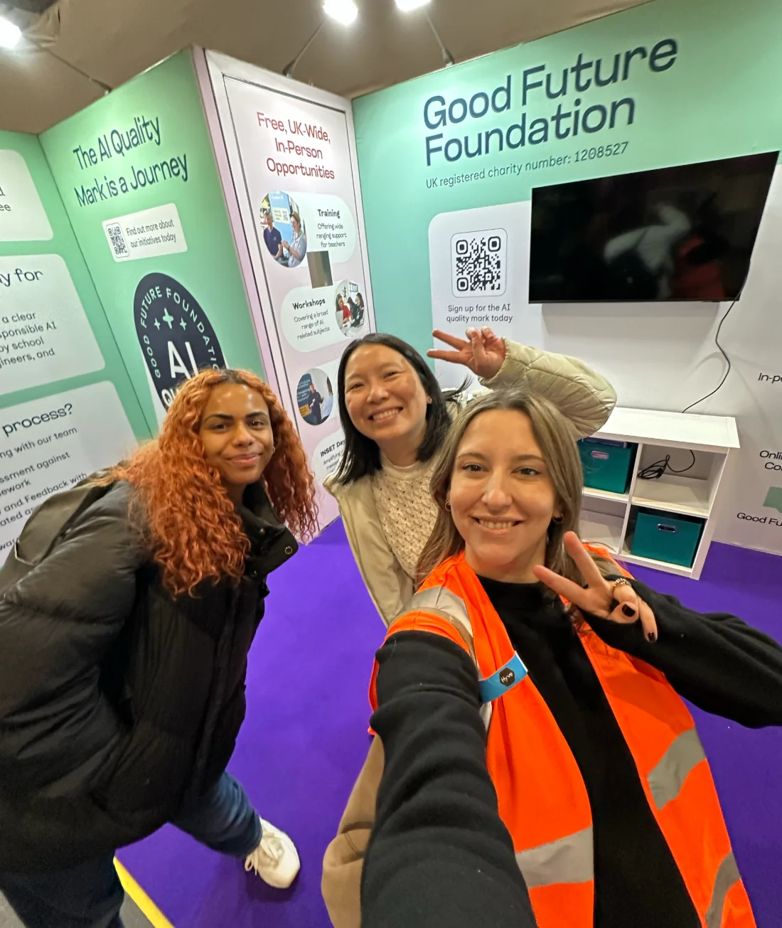 The Good Future Foundation stand at Bett, with the AI Quality Mark wall and team