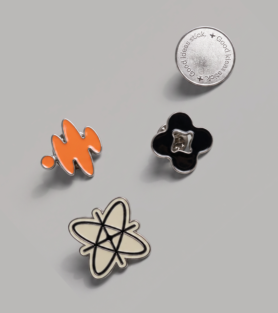Enamel pin set: the soundwave mark, a Good ideas stick badge and other brand forms