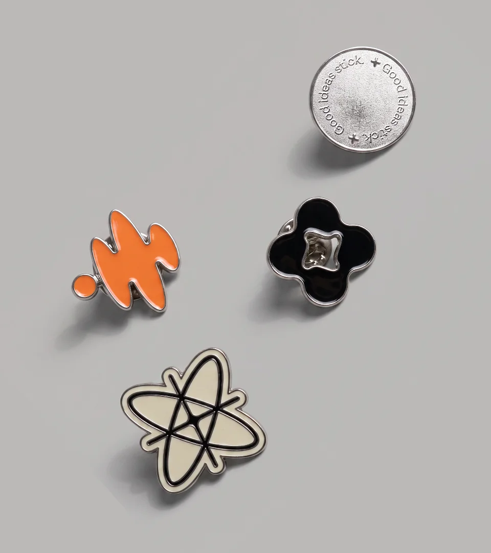 Enamel pin set: the soundwave mark, a Good ideas stick badge and other brand forms