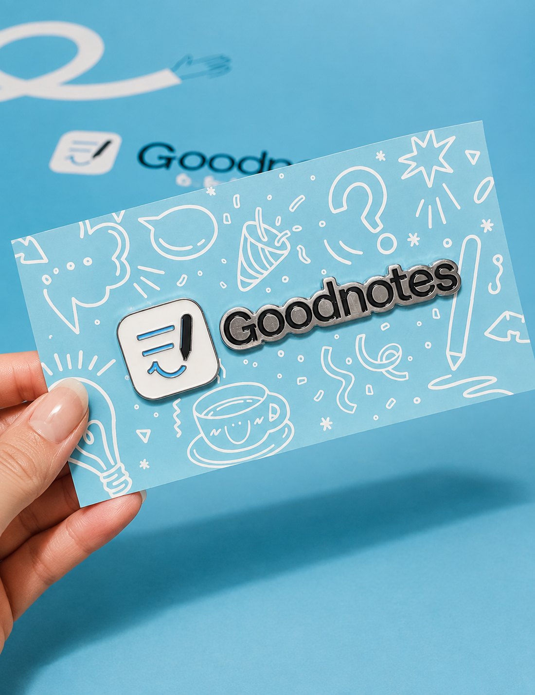 Enamel pin set on a branded backing card