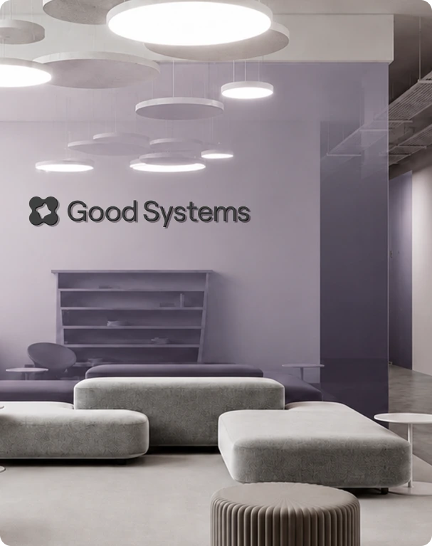 Good Systems wall signage in a lilac office lounge
