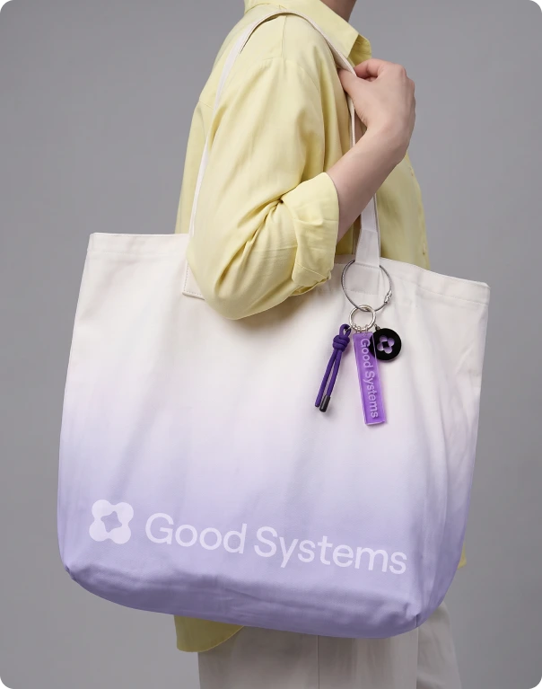 Lilac gradient tote with the Good Systems lockup and keyring