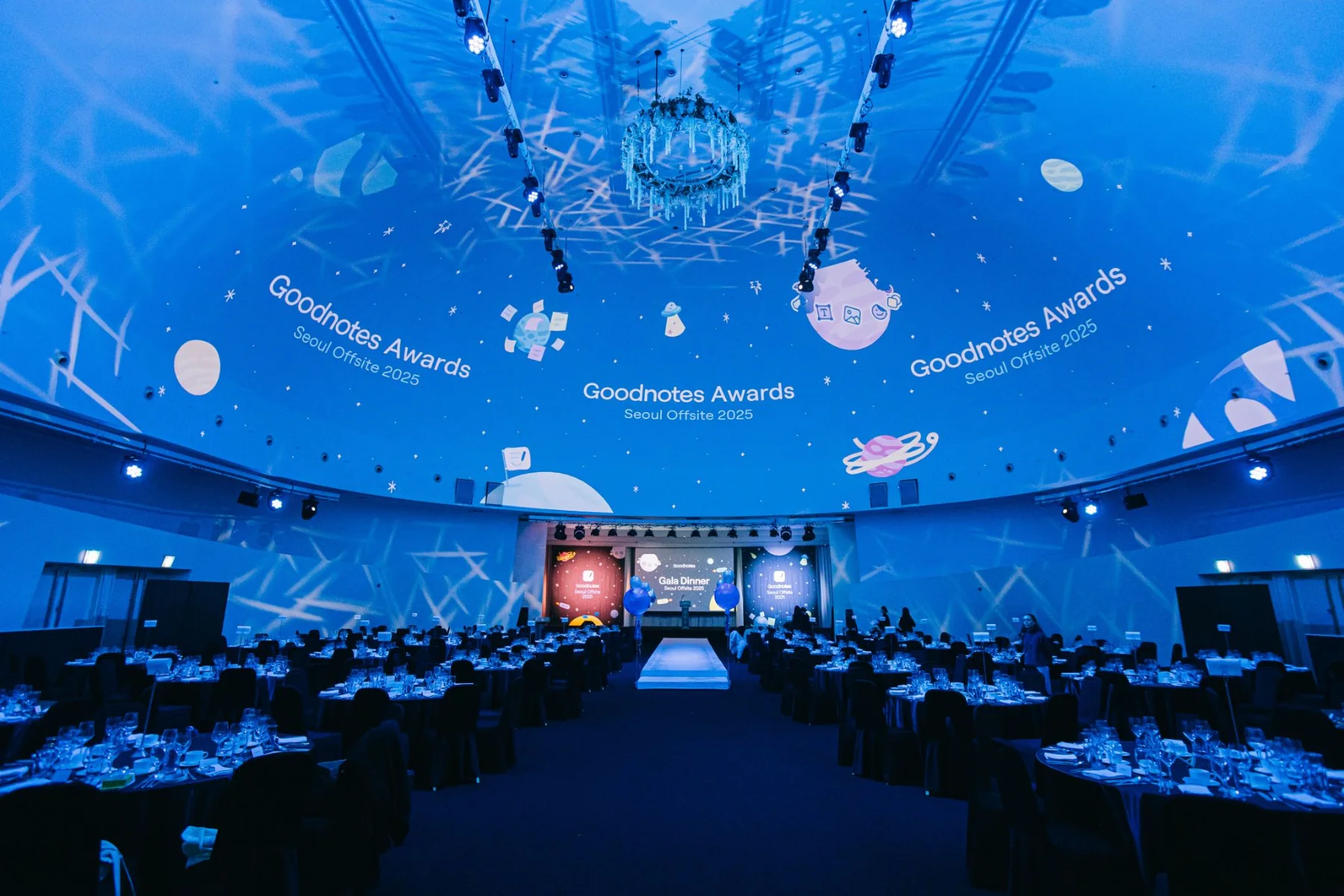 Floating Island hall with a ceiling projection of the Outernet campaign animation