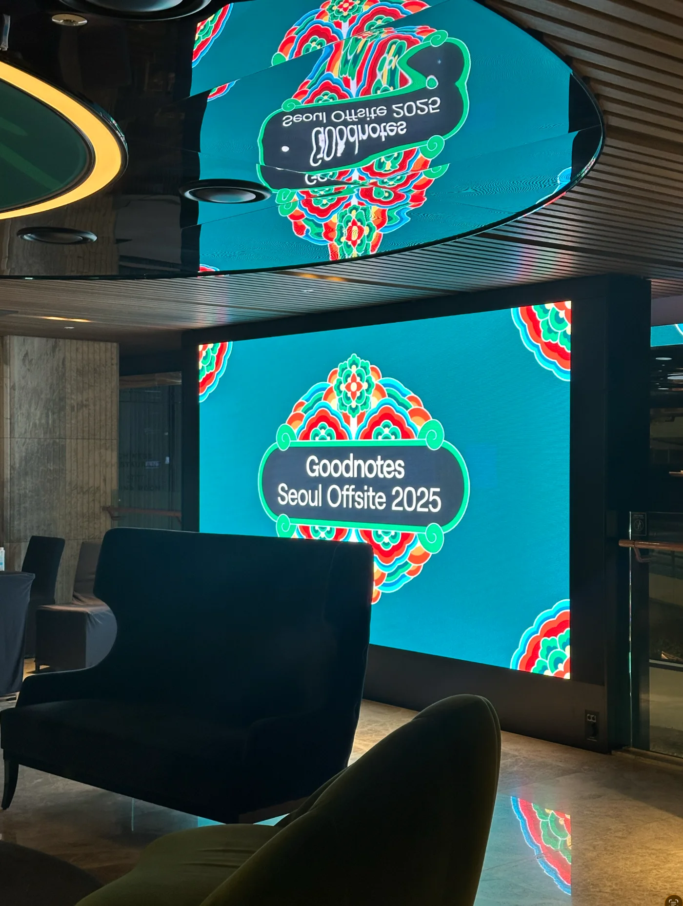 Seoul Offsite 2025 Dancheong graphic on the lounge LED wall, reflected in the ceiling