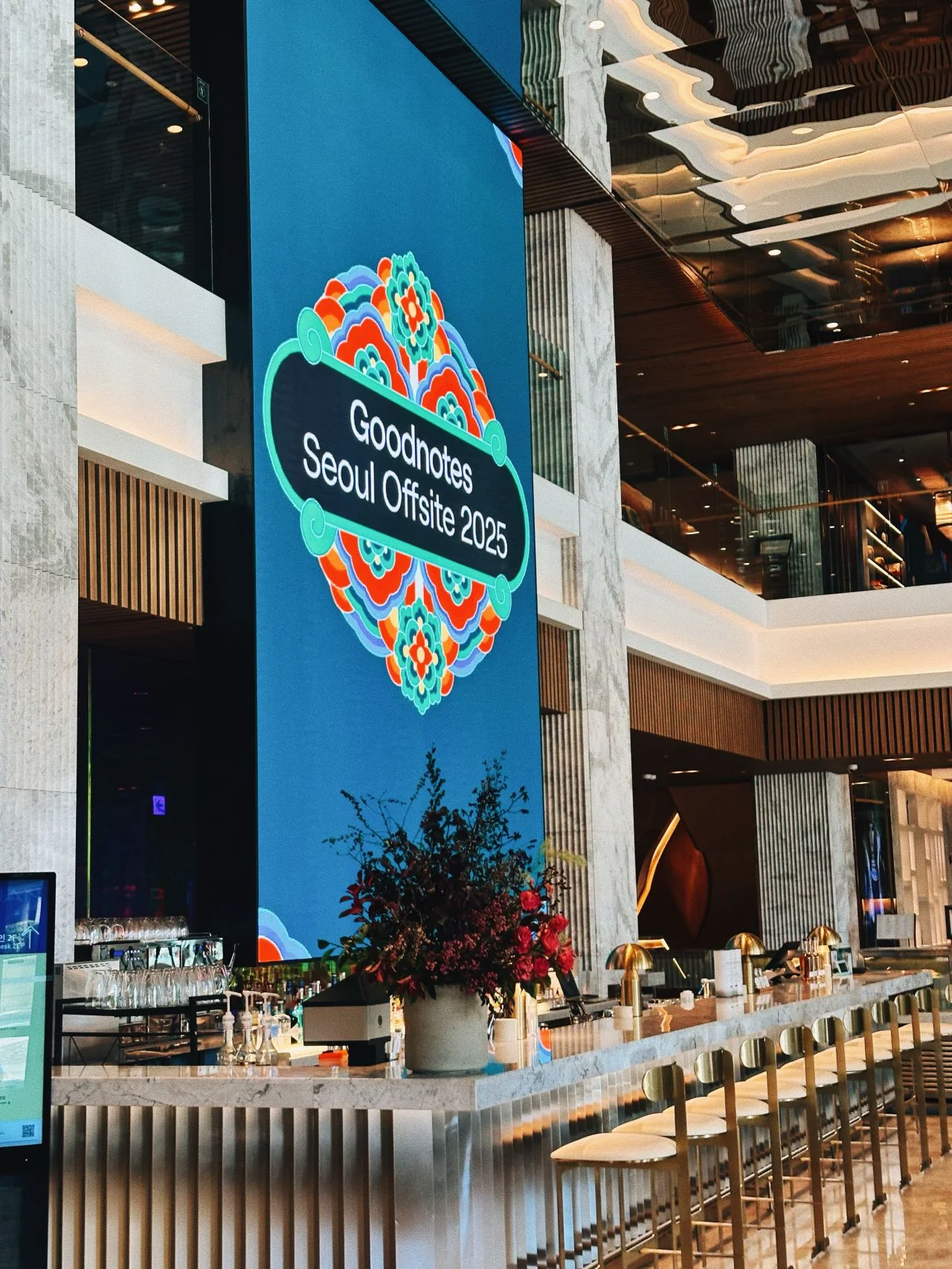 The Seoul Offsite 2025 Dancheong banner on the LED screen above the Mondrian lobby bar