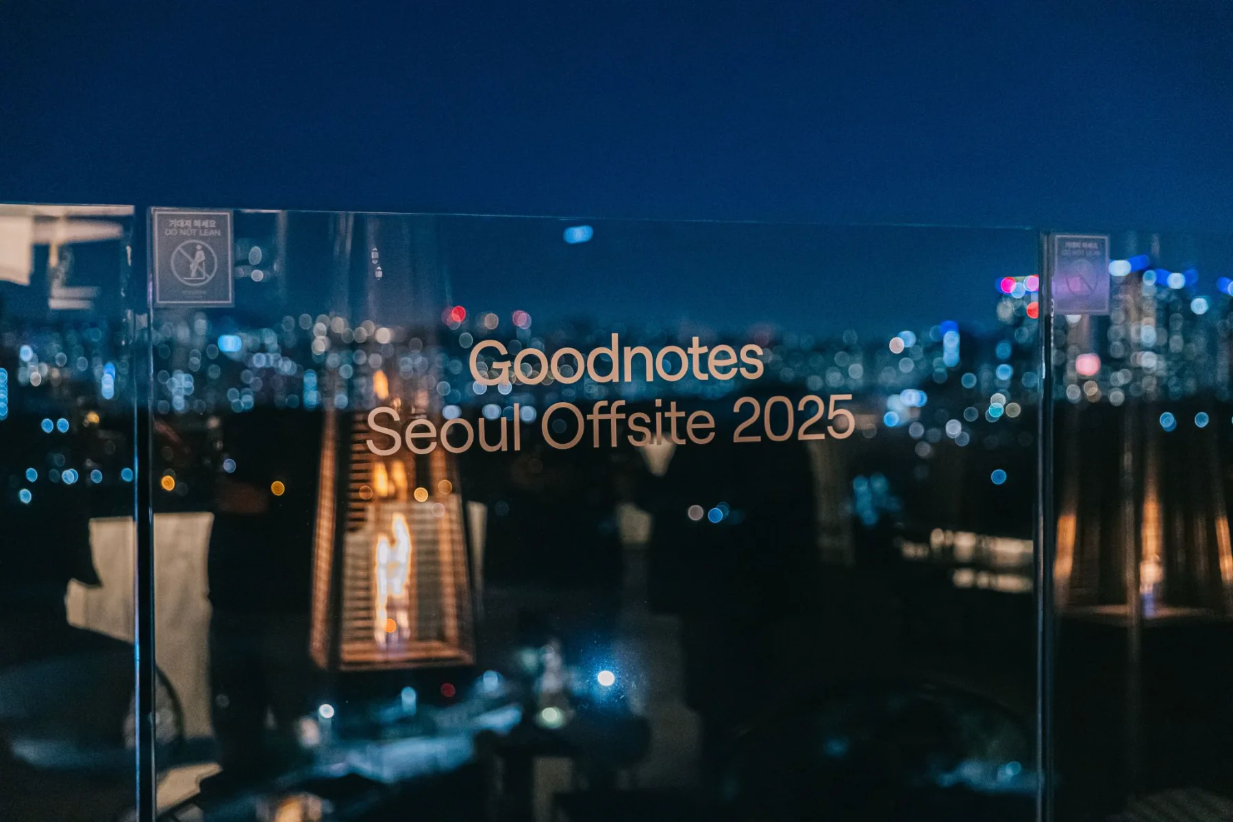 Seoul Offsite 2025 on the rooftop screen at night, over the city