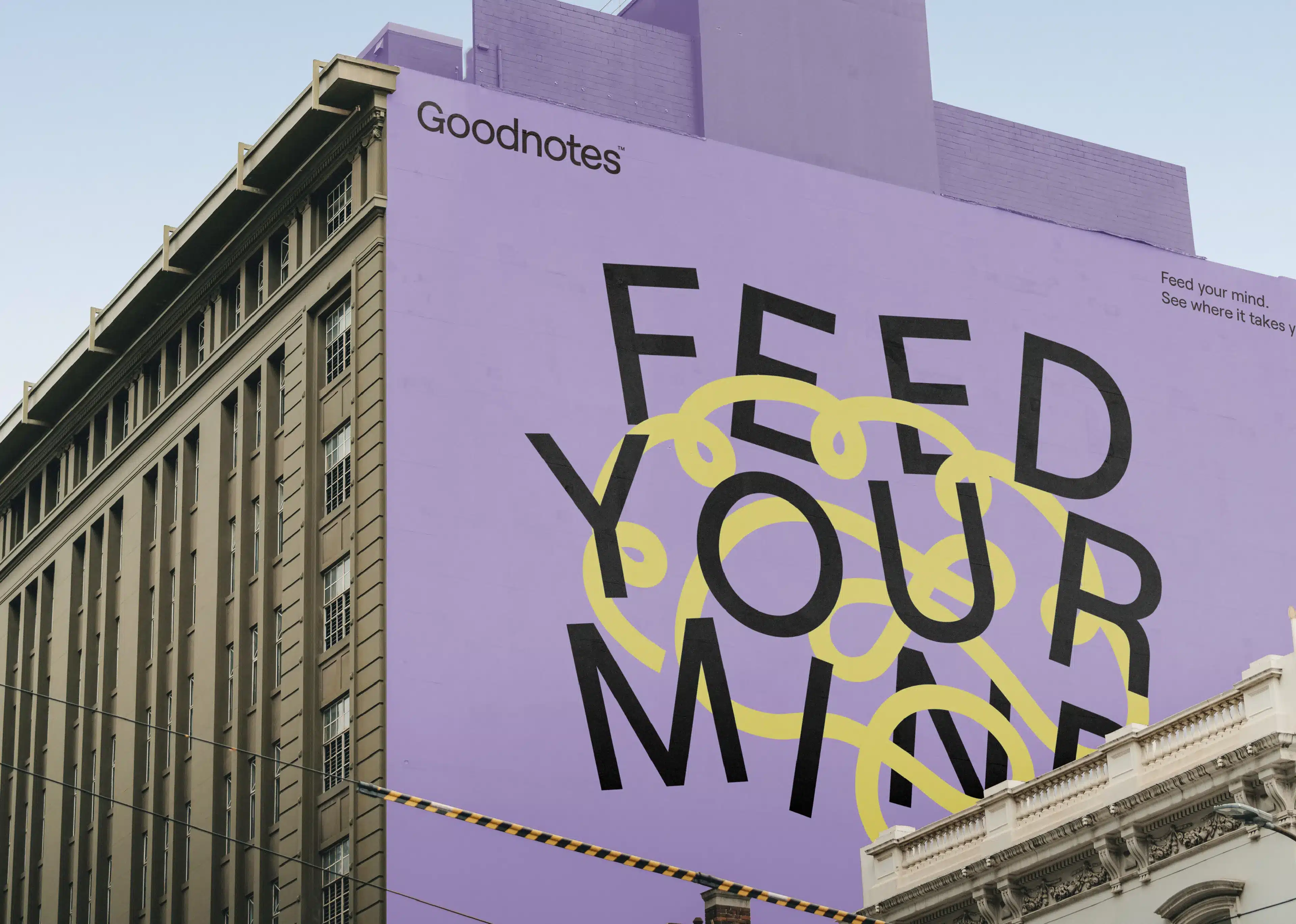 Feed your mind mural mockup on a building